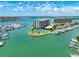 Waterfront condo complex with boat docks, a tennis court, and beautiful water views at 1 Key Capri # 301E, Treasure Island, FL 33706