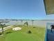 Relax on your balcony with views of the putting green and Gulf at 1 Key Capri # 301E, Treasure Island, FL 33706