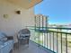 Cozy balcony setting with relaxing wicker chairs and community views at 1 Key Capri # 301E, Treasure Island, FL 33706