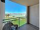 Private balcony with a beautiful view of the water and community amenities at 1 Key Capri # 301E, Treasure Island, FL 33706