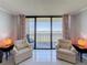 Charming seating area with lamps offering expansive views, inviting relaxation and stunning vistas at 1 Key Capri # 301E, Treasure Island, FL 33706