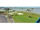 Balcony view of waterfront with putting green and shuffleboard at 1 Key Capri # 301E, Treasure Island, FL 33706