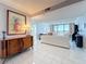 Elegant living room with tile floors, art, and breathtaking water views at 1 Key Capri # 301E, Treasure Island, FL 33706