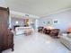 Spacious living room features tile floors, comfortable seating, and an open layout, perfect for entertaining at 1 Key Capri # 301E, Treasure Island, FL 33706