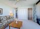 Inviting living room with ceiling fan, plush seating, and access to additional rooms at 1 Key Capri # 301E, Treasure Island, FL 33706