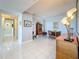 Spacious living room with tile flooring, crown moulding and ample natural light at 1 Key Capri # 301E, Treasure Island, FL 33706