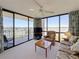 Comfortable living room with balcony access and water views at 1 Key Capri # 301E, Treasure Island, FL 33706