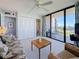 Cozy living room with a balcony, offering a view of the community and an inviting space to relax at 1 Key Capri # 301E, Treasure Island, FL 33706