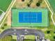 Overhead view of a fenced tennis court and parking lot at 1 Key Capri # 301E, Treasure Island, FL 33706