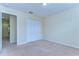 Empty bedroom with neutral carpet and closet at 10144 Arbor Run Dr # 122, Tampa, FL 33647