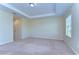 Bright bedroom with large window and tray ceiling at 10144 Arbor Run Dr # 122, Tampa, FL 33647