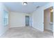 Neutral-toned bedroom with carpet, a window, and access to an ensuite bathroom at 10144 Arbor Run Dr # 122, Tampa, FL 33647