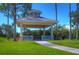 Picturesque gazebo with classic columns and a hexagonal roof, set amidst lush greenery at 10144 Arbor Run Dr # 122, Tampa, FL 33647