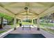 View from inside the community gazebo featuring a picnic table and outdoor views at 10144 Arbor Run Dr # 122, Tampa, FL 33647