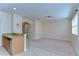Kitchen bar area leading to living room, offering seamless entertaining and additional seating at 10144 Arbor Run Dr # 122, Tampa, FL 33647