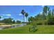 A scenic view of the park area with mature landscaping, tranquil water and a bench at 10144 Arbor Run Dr # 122, Tampa, FL 33647