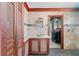Charming bathroom displays travertine tile, granite counters, and glass shower, exuding a spa-like feel at 112 Gause Dr, Venice, FL 34293