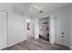 Bedroom featuring a ceiling fan, wood floors, and closet with folding doors at 112 Gause Dr, Venice, FL 34293
