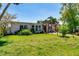 Well-maintained home featuring a verdant lawn and an inviting entrance at 112 Gause Dr, Venice, FL 34293