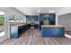 Open concept kitchen with center island, butcher block counters, backsplash, and stainless appliances at 112 Gause Dr, Venice, FL 34293