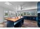 Kitchen with center island, butcher block counters, shaker cabinets, and open floor plan at 112 Gause Dr, Venice, FL 34293