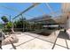 A shaded pool surrounded by lounge chairs offers a refreshing escape from the sun at 112 Gause Dr, Venice, FL 34293