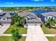Beautiful home with a three-car garage, stunning lake view, community pool, and solar panels at 11416 Carlton Fields Dr, Riverview, FL 33579
