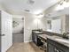 Bright bathroom with double vanity, granite countertops, and modern fixtures at 11416 Carlton Fields Dr, Riverview, FL 33579