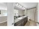 Bathroom with double vanity, granite countertops, tile flooring and bright lighting at 11416 Carlton Fields Dr, Riverview, FL 33579