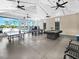Club house game room with ping pong, a pool table, and plenty of seating overlooking the pool at 11416 Carlton Fields Dr, Riverview, FL 33579