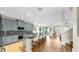 Open-concept kitchen boasts blue cabinets, granite counters, stainless appliances, and a breakfast bar with seating at 11416 Carlton Fields Dr, Riverview, FL 33579