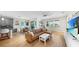 Open-concept living area integrates kitchen, dining, and lounge spaces for seamless modern living and entertainment at 11416 Carlton Fields Dr, Riverview, FL 33579