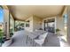 Stylish covered patio with views of lush landscaping, ideal for outdoor dining at 11416 Carlton Fields Dr, Riverview, FL 33579