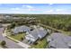 Stunning aerial view of the community featuring serene water views and mature trees at 12408 Palatka Dr, Venice, FL 34293