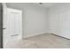 Bedroom showcasing a view into another bedroom and closet at 12408 Palatka Dr, Venice, FL 34293