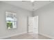 Bright bedroom featuring a ceiling fan and natural light streaming through the windows at 12408 Palatka Dr, Venice, FL 34293
