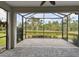 Spacious screened-in patio overlooking a pond, providing a serene outdoor living space at 12408 Palatka Dr, Venice, FL 34293