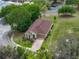 A beautiful aerial view of the home showcasing its manicured lawn and surroundings at 14198 Thoroughbred Dr, Dade City, FL 33525