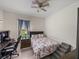 Cozy bedroom with stairs, decorative bedding and desk at 14198 Thoroughbred Dr, Dade City, FL 33525