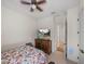 This cozy bedroom offers closet, TV, and ceiling fan at 14198 Thoroughbred Dr, Dade City, FL 33525