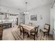 Open dining area complements the kitchen and living space, with great lighting at 14198 Thoroughbred Dr, Dade City, FL 33525