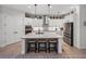 Modern kitchen boasts a large island, stainless steel appliances, and ample storage at 14198 Thoroughbred Dr, Dade City, FL 33525