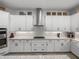 Bright kitchen features stylish cabinetry, modern appliances, and sleek countertops at 14198 Thoroughbred Dr, Dade City, FL 33525