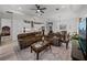 Open-concept living room with couches, a kitchen island, and recessed lighting at 14198 Thoroughbred Dr, Dade City, FL 33525