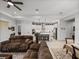 Bright open layout connects living room, dining area, and a modern white kitchen at 14198 Thoroughbred Dr, Dade City, FL 33525