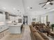 Open layout featuring a modern kitchen, dining area, and inviting living room at 14198 Thoroughbred Dr, Dade City, FL 33525