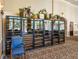 Wine cellar with multiple glass door refrigerators and wine racks at 14198 Thoroughbred Dr, Dade City, FL 33525