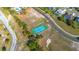 Aerial view showcases the tennis court within the community at 14296 Pullman Dr, Spring Hill, FL 34609