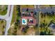 Aerial view of community pool, clubhouse, playground and manicured landscaping at 14296 Pullman Dr, Spring Hill, FL 34609