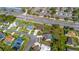 Aerial view of neighborhood with lush landscaping, sidewalks, and mature trees at 14296 Pullman Dr, Spring Hill, FL 34609